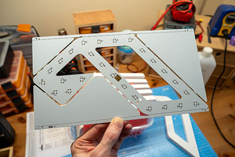 Unpopulated PCB with factory rails/fiducials